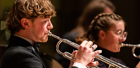 A student playing a trumpet during Christmas at Concordia, our yearly Christmas concert.