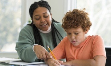 teacher doing work with a student