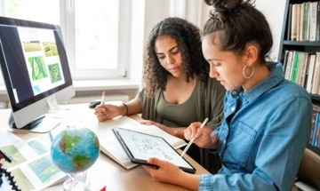 two women collaborating at desk