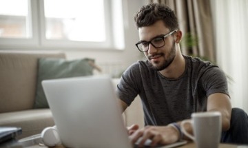 mba student doing work at laptop