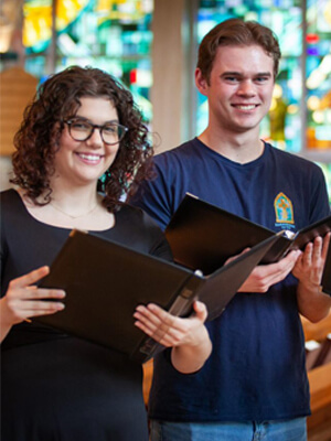 Students singing in chapel